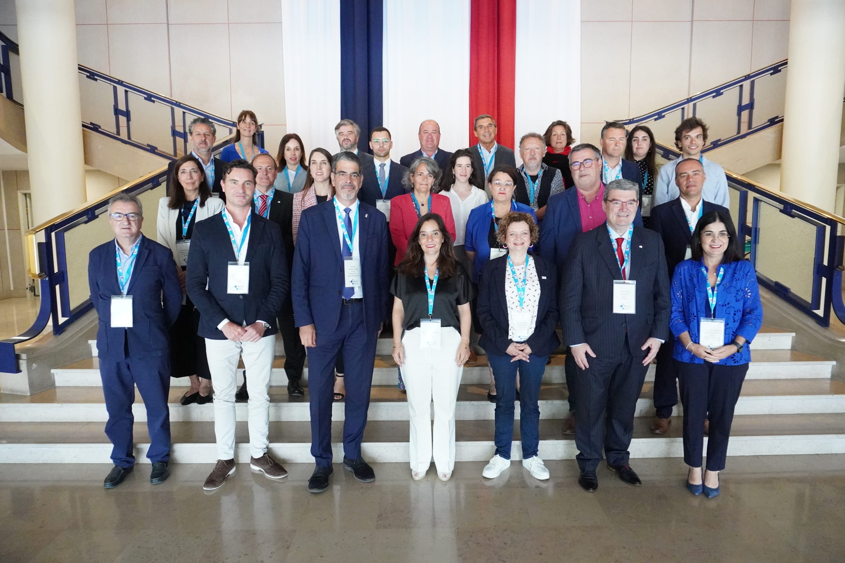 The photo shows all the city representatives who attended the Atlantic Cities General Assembly Meeting in the City Hall of Brest, France. We can see the French flag in the background.